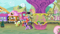 The train in Ponyville, featuring Derpy Hooves and some new elderly ponies (pink locomotive)