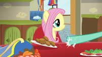 Zephyr pushing Fluttershy's lunch plate aside S6E11