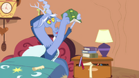 Discord holding a book S4E11