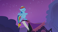 Rainbow standing on top of Rarity's tent S3E06