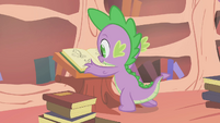 Spike smiling with open book S1E9