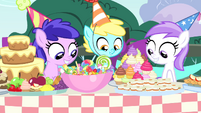 Foals looking at table of treats S4E23