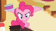 Pinkie Pie "assaulting" Spike with cake S2E10