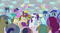 Rarity surrounded by angry ponies.