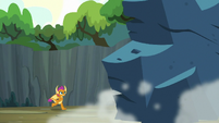 Smolder running toward the giant rock S9E3