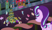 Starlight Glimmer observes ponies from the balcony S6E8