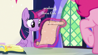 Twilight Sparkle looking at Prince Rutherford's scroll S7E11