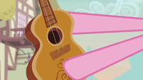 Pinkie Pie offering her guitar to Rarity S7E9