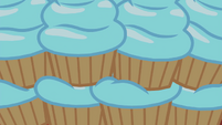 Stack of cupcakes with blue frosting EG4