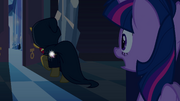 Twilight sees Sunset Shimmer in cloak EG