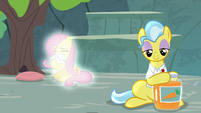 Angel and Fluttershy glow behind Dr. Fauna S9E18