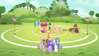 Applejack on buckball field explaining buckball to the unicorns S6E18