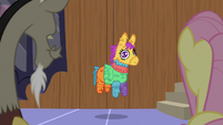 Living pinata hanging from a string S7E12