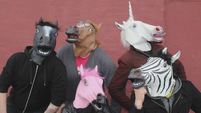Crew members in horse masks hidden frame S5E9