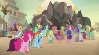 Rainbow, Pinkie, and A. K. in the village square S7E18