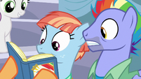 Bow and Windy look closely at Scootaloo's scrapbook S7E7