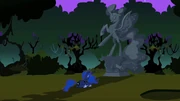 Luna in front of statue S2E04