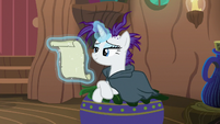 Rarity sitting on Zecora's lounge chair S7E19