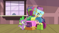 Spike grabbing a bag in the pile S4E8