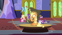 Applejack drifts by on a floating table S6E21