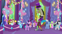 Discord returns to normal size in a purple suit S7E1