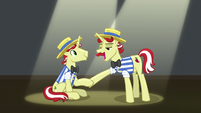 Flam lending a helping hoof to Flim S8E16