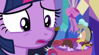 Twilight Sparkle looking at tiny Discord S7E1