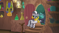 Zecora pointing outside her hut door S7E19