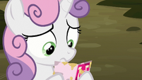 Sweetie Belle looking at Big Mac's invitation S8E10
