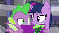 Spike talks to Twi behind Power Ponies comic S9E5