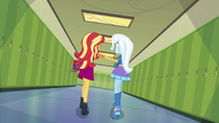 Sunset punches Trixie's arm as they walk EGFF