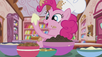 Pinkie taking a bit of the cocoa-flavored buttercream S5E8