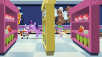 Twilight and Spike race through the toy store S7E3