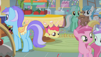 Apple Bloom peeking out from under a table S1E12