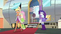 Chestnut Magnifico walks past Fluttershy and Rarity EGS2