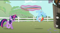 Twilight holds Rainbow Dash by the tail with her magic S2E03