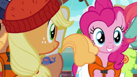 AJ and Pinkie look at line of porter ponies S6E22