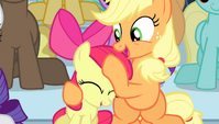 Applejack giving Apple Bloom a noogie S4E24