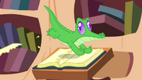 Gummy ripping off the pages of a book S3E11