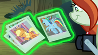 Photographer looks at AJ and Rainbow's photos S8E13