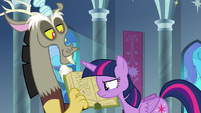 Twilight looks at Discord's book S9E1