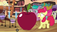 Apple Bloom next to growing apple S4E15