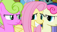 Fluttershy awkwardly smiling at Daisy and Sweetie Drops S2E19