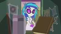 DJ Pon-3 taking book from locker EG2