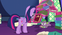 Twilight levitating a book near Spike S5E23