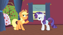 Applejack and Rarity talking next to Bloomberg S1E21