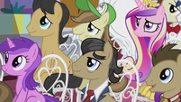 Assorted ponies listening to the mayor S5E9