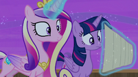 Princess Cadance holds the schedule with her magic S7E22
