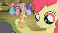 Tiny Applejack in Apple Bloom's hoof S1E09