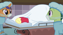 Big Mac's hoof sticks out from under gurney sheets S6E23